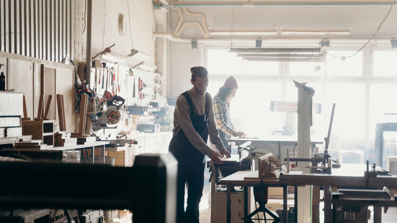 A portrait of the three professional craftsmen in their Fukuoka workshop.